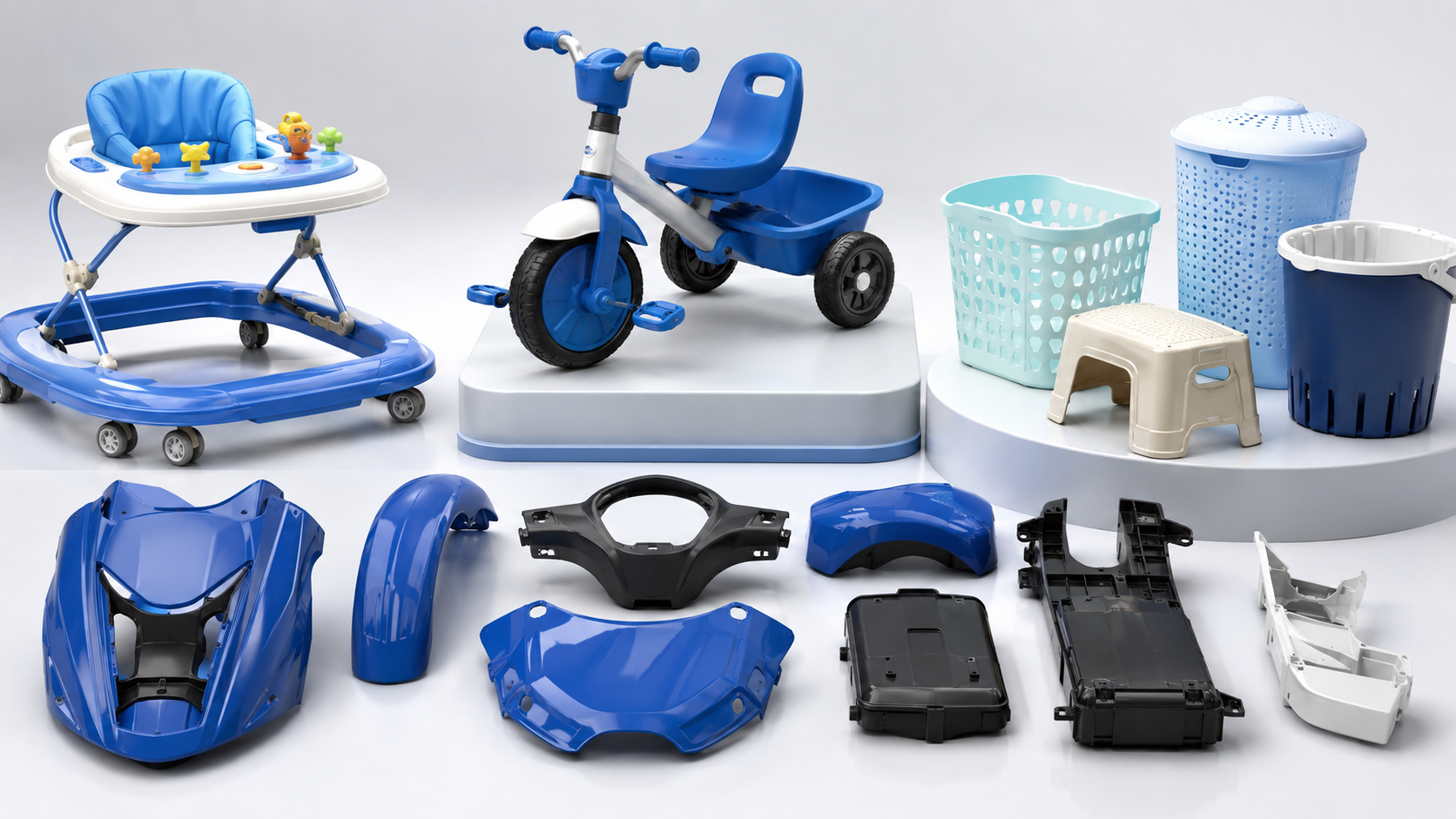 Plastic baby products, household products and mobility components displayed in a studio
